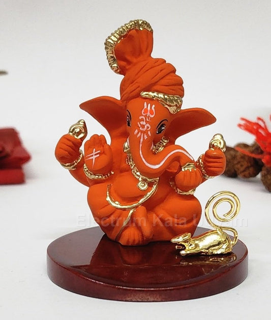 Orange Ganesha Idol with Gold Plated Mooshak